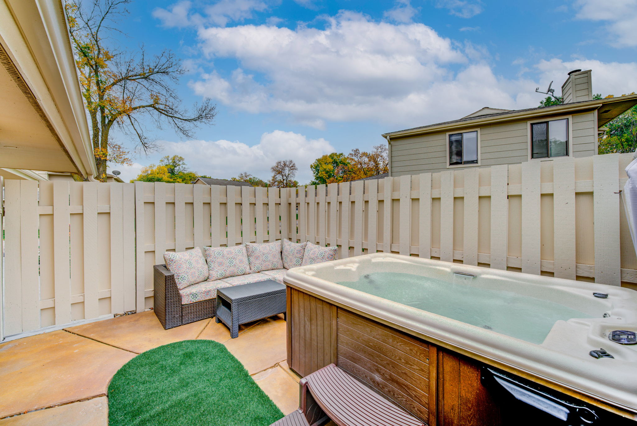This cozy patio extends your living space year round. And, the hot tub is included. Yes!