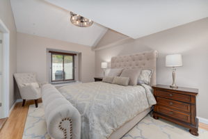 The main floor bedroom is lovely. There is a nice window overlooking the fenced patio area. Very private.