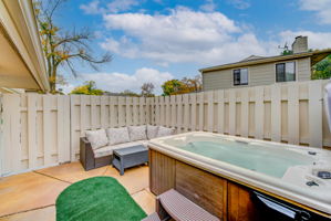 This cozy patio extends your living space year round. And, the hot tub is included. Yes!