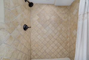 The main floor shower. Beautiful tile work!