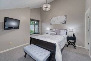 The upper level en-suite bedroom is well appointed with a large closet and a beautiful view of the private back yard.