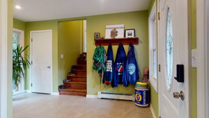 Entry with steps up to Primary Suite